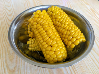 Corn on the cob in a bowl ready to be served.