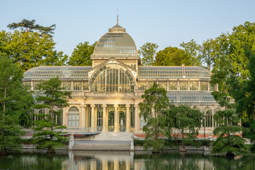 Fototapeta na wymiar The Glass Palace built in 1887 (Palacio de Cristal) in the public park of Retiro, Madrid, Spain.