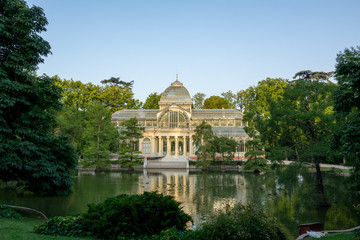 Fototapeta na wymiar The Glass Palace built in 1887 (Palacio de Cristal) in the public park of Retiro, Madrid, Spain.