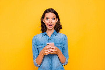 Portrait of excited girl use her smart phone text type post on social network scream wow omg wear...