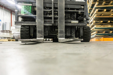 Forklift on factory workshop used for moving materials around