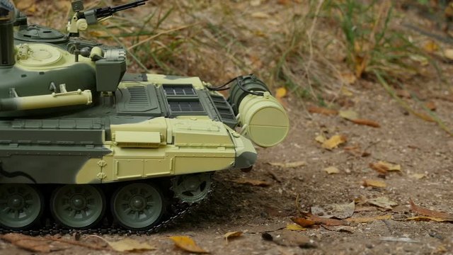 Russian tank T-72 in camouflage coloring camera in motion