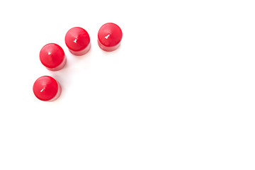 red candles on white background