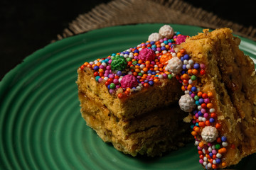 Peruvian classic dessert, turron de Doña pepa with honey and candies
