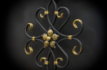 Decorative metal elements of the gate in dark colors