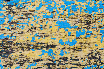 Wooden background with blue and yellow paint