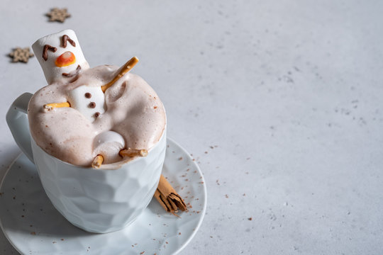 Hot chocolate with melted marshmallow snowman