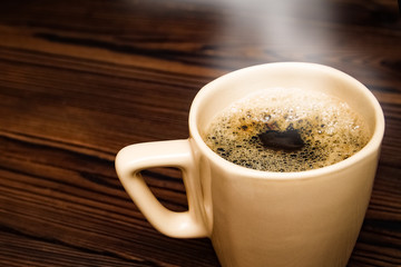 tasty coffee on a wooden background