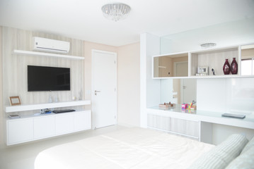 modern room with white furniture and bed