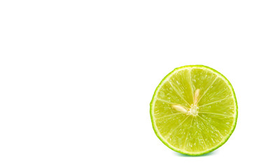 green lemon and slice isolated on white