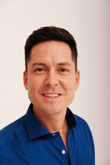 Studio portrait of handsome man in blue shirt 