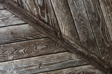 Wooden background in dark colors with a diagonal board