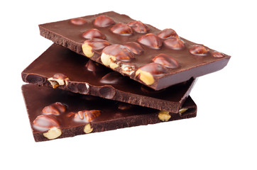 Pieces of chocolate with nuts on a white background