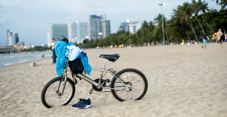 one bicycle parked in the beach. Bicycle parking in the beach sand.