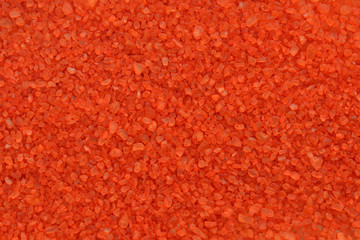 Bright orange mineral bath salt top view background