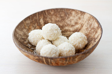 coconut candy in a plate of coconut