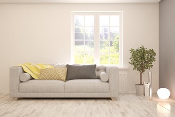 Stylish room in white color with sofa and summer landscape in window. Scandinavian interior design. 3D illustration