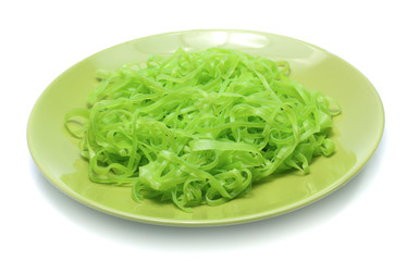 green noodles on dish isolated on white background