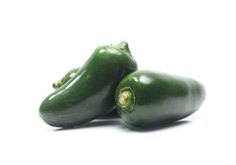 green chilies on white background (jalapeno)