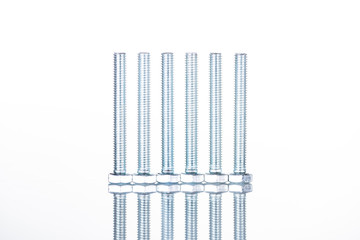 close up view of shiny long bolts isolated on white with copy space