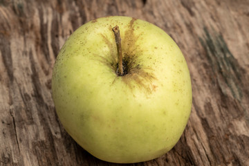 natural and healthy green apple on a wooden table with copy space