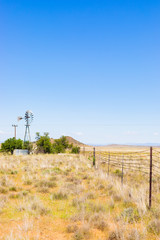Windmill on a farm in rural grassland area of South Africa