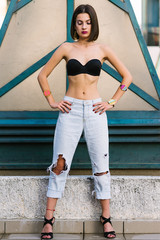Portrait of young fashionable woman wearing jeans