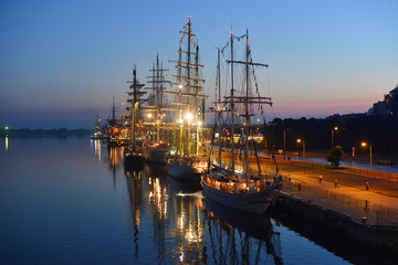 World largest tall ships berthed by a pier of the passenger terminal in the port of Riga on the...