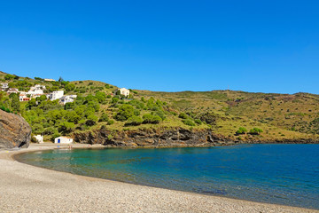 Beach on the Mediterranean Sea among the green slopes