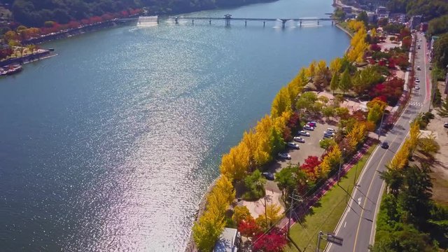 Aerial video of Wolyeonggyo bridge is located in the midst of Nakdong river in the morning during Autumn season at Andong city, South Korea.