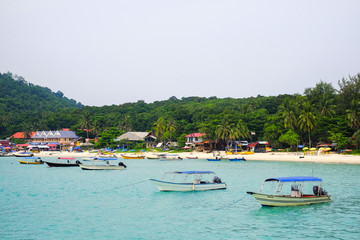Naklejka na ściany i meble Pulau Perhentian, Terengganu - August 14th, 2018 : Beautiful view of small Perhentian Island with multiple boats. Perhentian Island is the most favourite holiday destination among locals and tourists