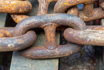 Rusty anchor chain in dry dock