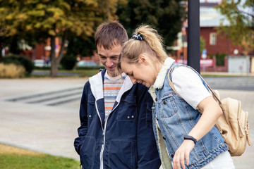 A married couple spends their summer weekend in a city park.
