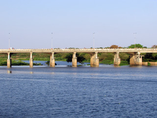 Fototapeta na wymiar Acarau river view with bridge in the background
