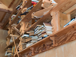 mess of old books on  shelves