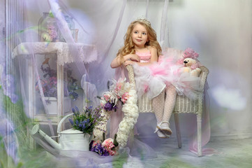 cute princess in pink sits in a chair © Evdoha