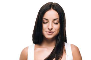 Fototapeta premium brunette beautiful woman with closed eyes and long straight healthy and shiny hair isolated on white