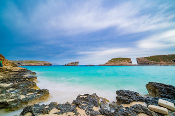 Fototapeta na wymiar Pure crystal turquoise water of Blue Lagoon in Comino Malta