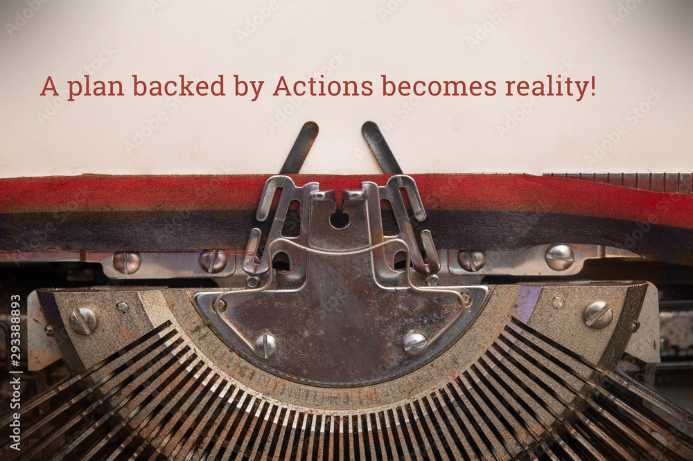 Fototapete Old manual typewriter typed text a plan backed by actions becomes reality