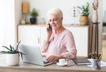 Ambitious elderly business woman working from home
