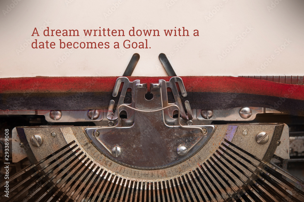 Fototapete typewriter typed text of a dream written down with a date becomes a goal