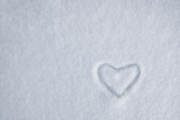 white heart on snow in a snowdrift