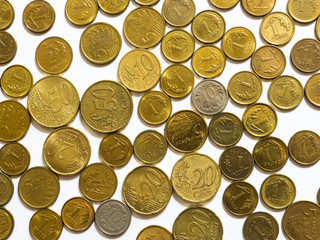 Flat lay of mixed coins isolated on white background. Mix of euro cents and Polish coins grosz. Background for business, banking or commerce.
