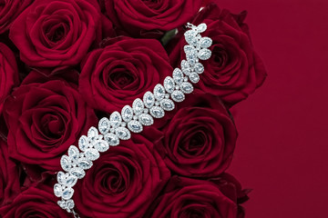 Luxury diamond jewelry bracelet and red roses flowers, love gift on Valentines Day and jewellery...