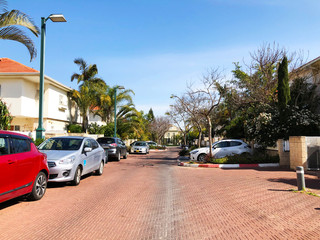 RISHON LE ZION, ISRAEL  March 12, 2019: Private houses, trees and streets in Rishon Le Zion, Israel.