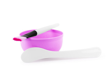 Bowl and mask brush on a white background