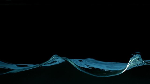 Super slow motion of splashing water isolated on black background. Filmed on very high speed camera, 1000 fps.