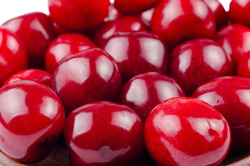 Closeup of ripe sweet cherries on a plate.