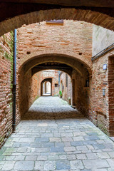 Backstreet with arches of brick