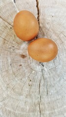 raw egg on wooden floor,egg on wooden background